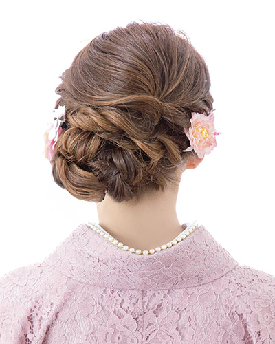 Side-swept rope braid updo perfect for Kyoto Kimono Rental photos in traditional streets.