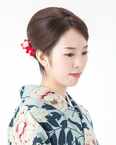 Modern French twist updo complementing a high-quality Kyoto Kimono Rental.